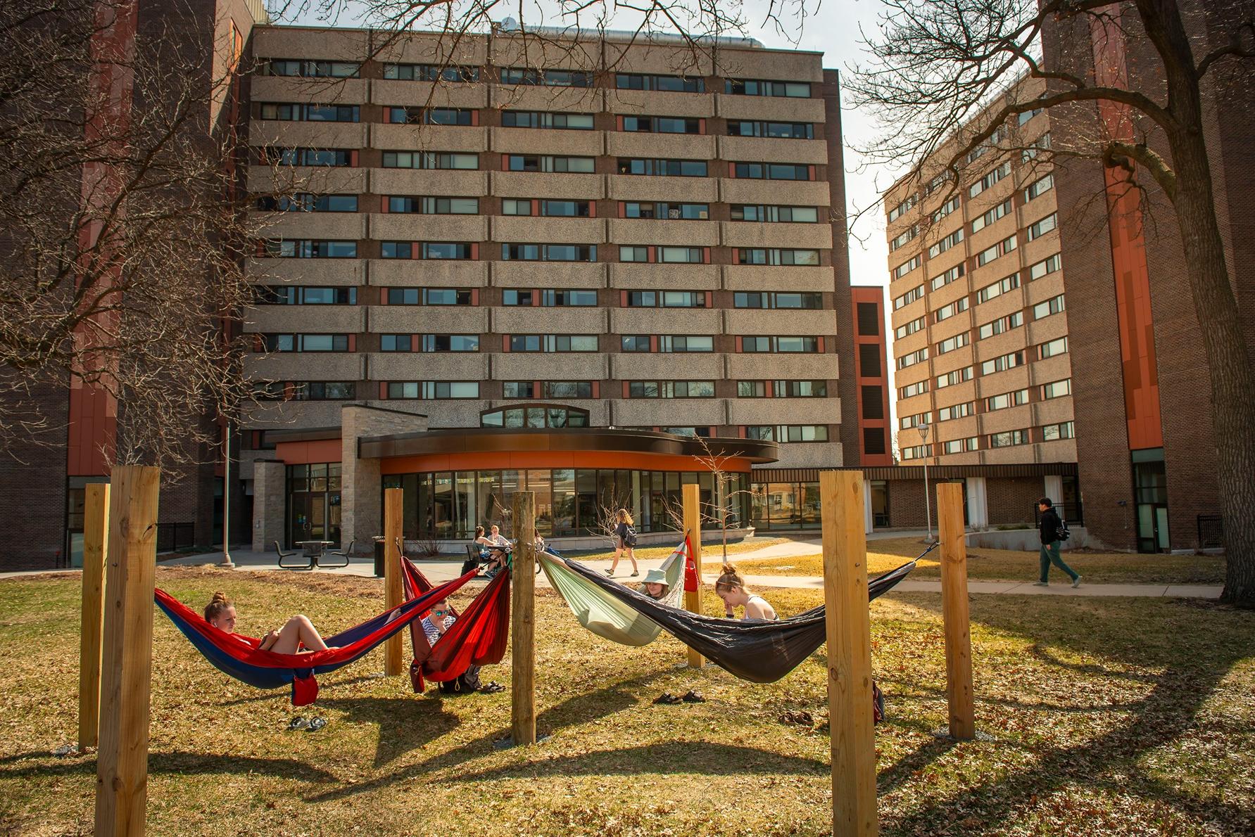 hammocks hanging on upper campus near residence halls 